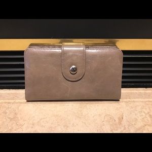 HOBO Tan wristlet with sliding wrist strap